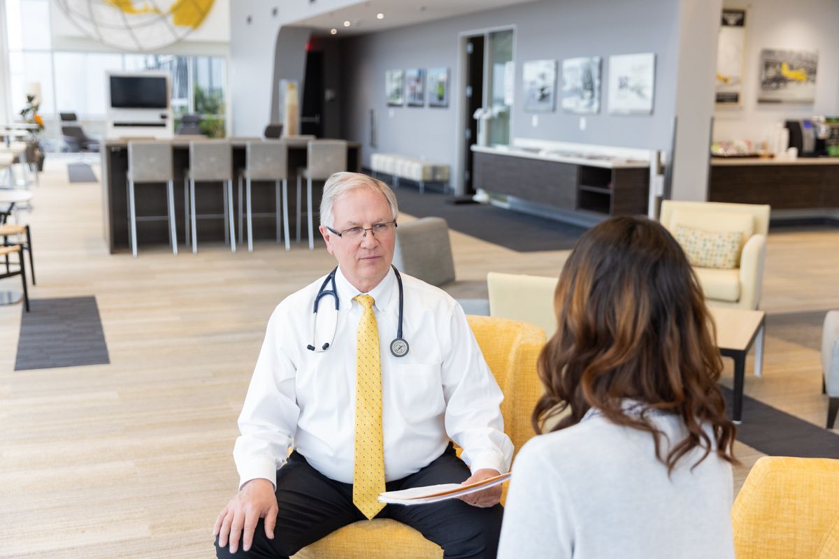 Dr. Edmondson discussing a complex medical history with a pilot
