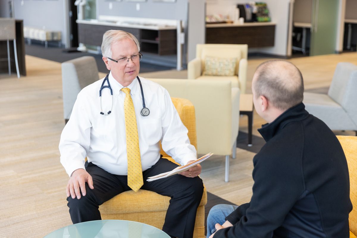 Dr. Edmondson reviewing a pilot's medical history